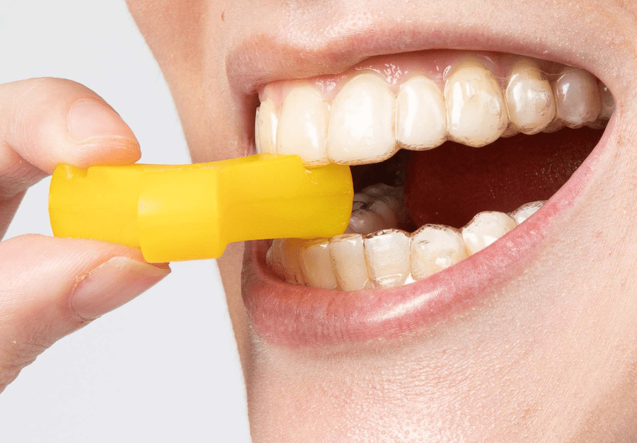 Close-up of Yellow Munchie in mouth engaging with incisor